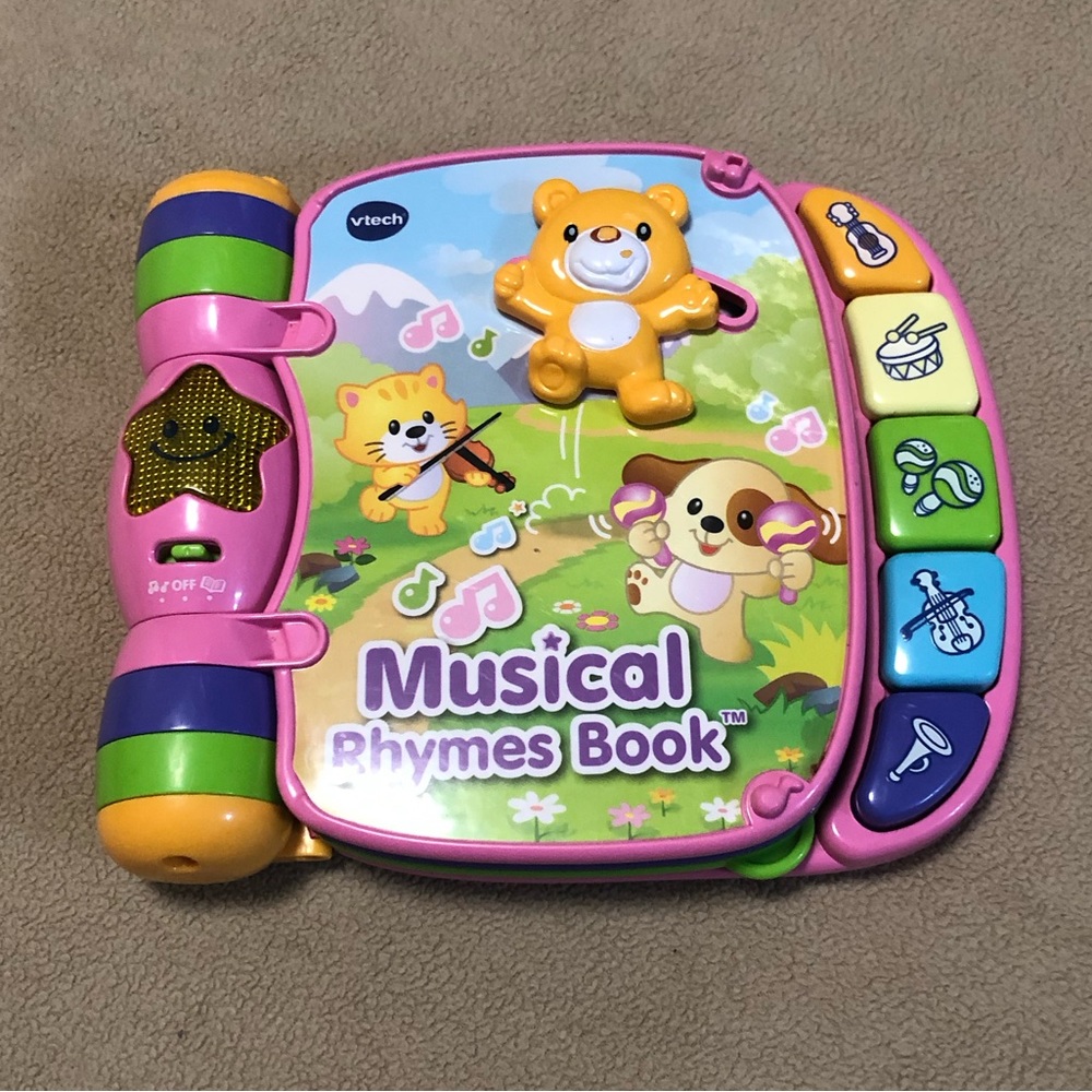 VTech Musical Rhymes Book:  6 singing songs  five music color pink.